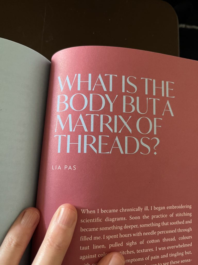 The Sharp Notions book open to the first page of Lia’s essay: What is the Body but a Matrix of Threads.
